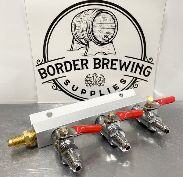 Gas Manifold 3 way Gas Line splitter with one way check valve. This gas manifold has a one way check valve that will stop beer from flowing back into your regulator. The 3 way gas manifold is rated for 100psi and has MFL threads that accommodate push in duotight fittings.