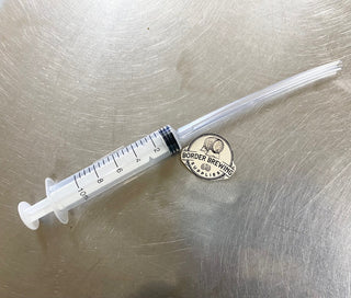 Measuring Syringe + 10cm extension tube Profile Measure 10ml Perfect for measuring small amounts of liquids which makes them perfect for measuring out essence flavours.  Includes 10cm extension tube, for getting every last drop of essence out of the bottle.