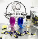 Butterfly Pea Flower gin changing from blue to purple with citrus