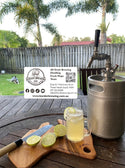 Glass of homemade Morgan's Ginger Beer served over ice with fresh lime