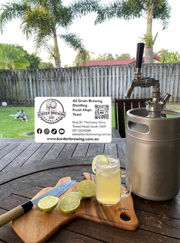 Glass of homemade Morgan's Ginger Beer served over ice with fresh lime